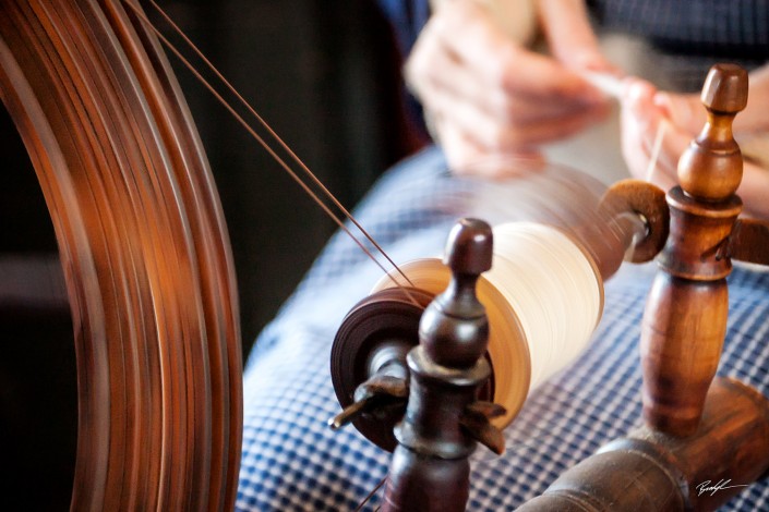 Spinning Wheel and Woman's Hands